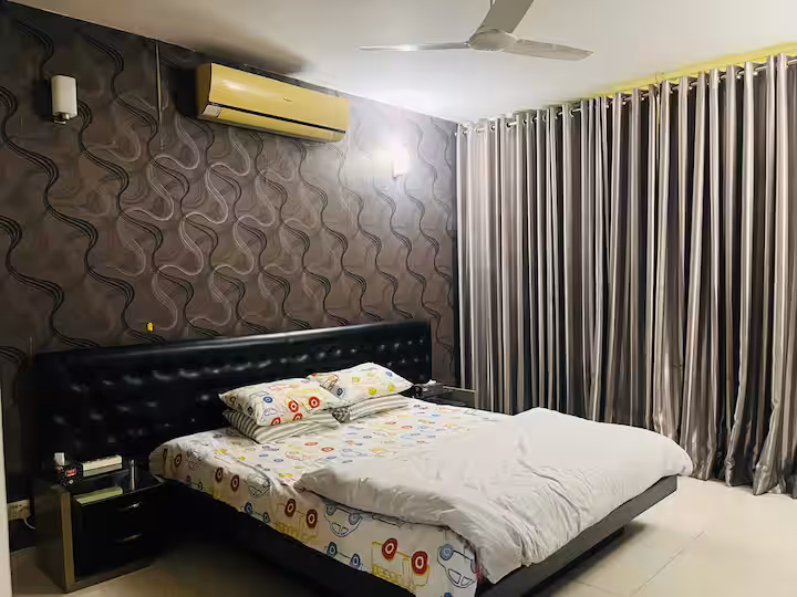 A private bedroom at Tourist Living Suites